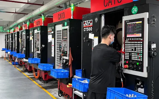 Row of CNC machining centers on the HERO Precision shop floor